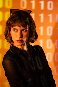 Stylish woman with sunglasses against digital binary code backdrop