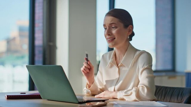 Professional woman talking webinar explaining information at workplace closeup.