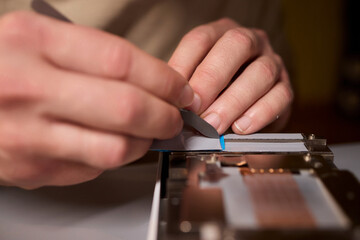 Hand Repairing a Graphics Card through the Application of Thermal Paste for Better Performance