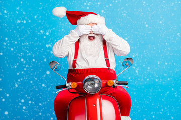 Photo of excited santa claus ride scooter x-mas magic surprise christmas stylish modern party close...