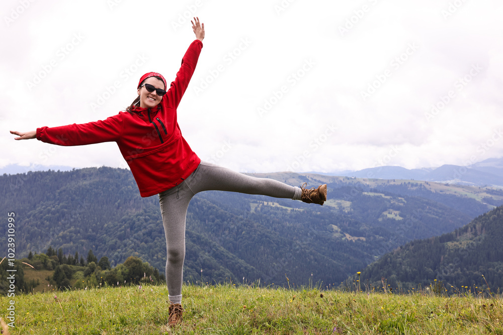 Sticker Happy young hiker in mountains. Active tourism