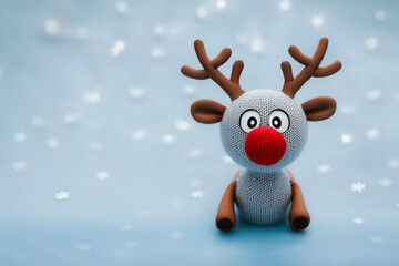 An adorable red-nosed fabric reindeer, a warm and festive touch to Christmas.