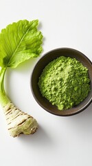 Vertical format, Freshly grated wasabi root and green wasabi paste in a bowl on a white background with horseradish leaves
