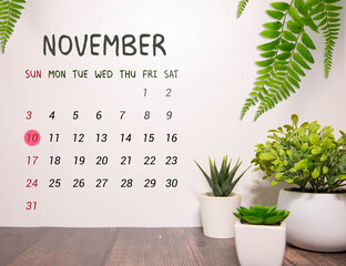 November 10th. Image of november 10 wooden color calendar on white background.