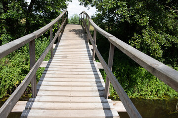 wooden suspension bridge across the river