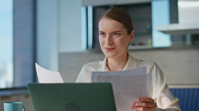 Smiling seo reading report expressing satisfying in remote workplace closeup. 