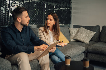 Businesspeople at modern office discussing start up business strategy.