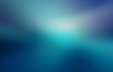 Fototapeta premium A blurred gradient background transitioning from deep blue to teal.