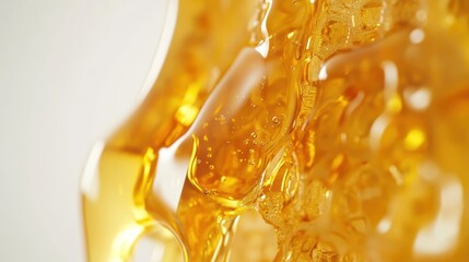Close-up of a glossy, amber liquid with bubbles, suggesting a viscous texture.