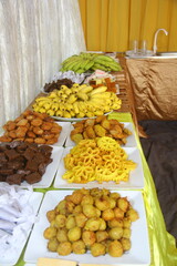 An elegant display of traditional Sri Lankan sweets served at a wedding. Featuring vibrant, intricately designed treats that celebrate the rich cultural heritage and flavors of Sri Lanka