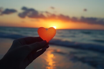 Fototapeta premium Red Heart Silhouette at Sunset with Ocean Background
