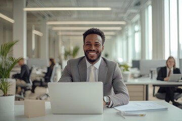 Obraz premium Business Professional Smiling at Desk in Modern Office During Work Hours, Showcasing a Positive Workplace Environment and Teamwork