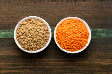 Red and brown lentil in two bowl - Lens culinaris.