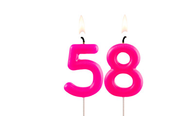Pink number 58 birthday candle on white background