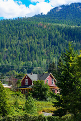 Luxury wooden mansion in the forest of the Selkirk Mountains overlooking the west arm of the Kootenay Lake in Nelson, British Columbia, Canada