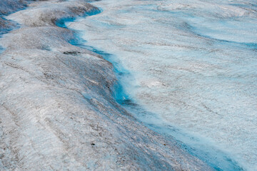 Meltwater flowing down the Athabasca Glacier in the Columbia Icefield, Jasper National Park,...
