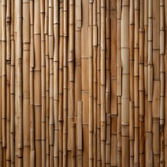 Fototapeta premium Vertical bamboo stalks tightly arranged create a natural brown textured background, ideal for organic and eco-friendly themes.