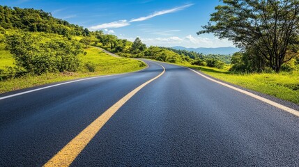 Obraz premium A Winding Road Through Lush Green Hills on a Sunny Day Inviting Travelers to Explore Nature's Beauty