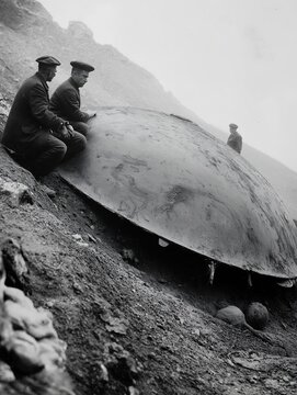 turtle laying ground man sitting armor ufo crash site looking down massive crater archived large shell people discussing space whale
