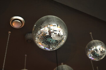 Disco ball in the club. Mirror ball in the interior. Interior details.