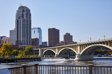 Scenic Mississippi River running through bridges and dams with Minneapolis Minnesota in the background in fall