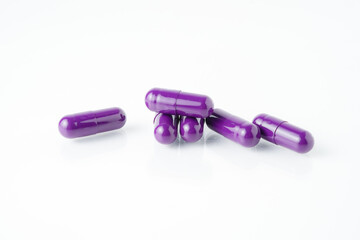 Pile of medical capsule pills, supplement vitamin, isolated over the white background