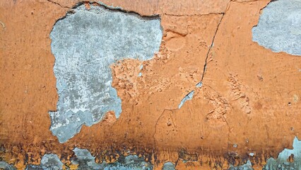 close up texture of torn orange wall with soft shadow 
