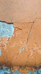Obraz premium close up texture of torn orange wall with soft shadow 