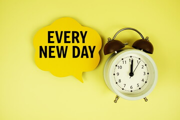 Every New Day text on speech bubble with alarm clock on green background