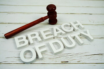 Breach Of Duty alphabet letters and magnifying glass top view on wooden background