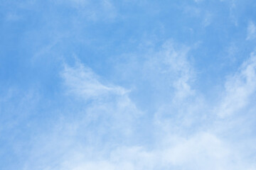 Obraz premium Blue sky background and white clouds soft focus, and copy space horizontal shape.