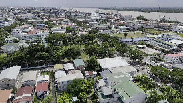 Drone flies toward gardens behind state house next to Walter Roth Museum of Anthropology in Georgetown, Guyana