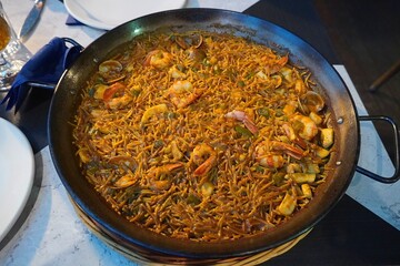 Fideua fish paella plate, served in a restaurant, in Barcelona, Spain