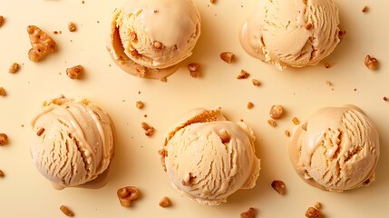 Butterscotch ice cream with toffee bits on light yellow background