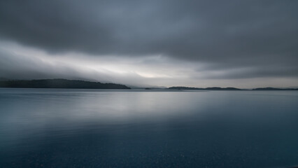 A misty Loch Lomond at sunset, Glen Coe National Park, Scotland.