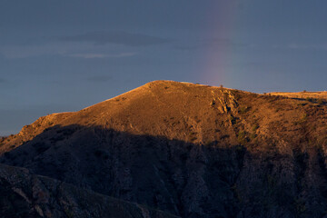 Fototapeta premium Mountain Hill with Faded Rainbow: Hurry Up and Make a Wish