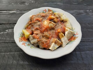 Siomay or Indonesian food from java on the black wooden table, High angle view 