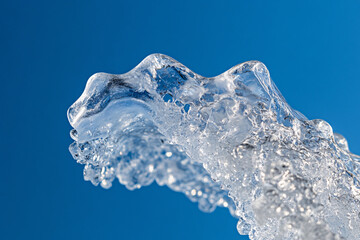 clear ice water splash on blue background
