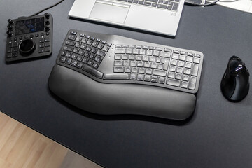 Ergonomic keyboard and ergonomic mouse as ergonomic home office equipment for freelance work and...