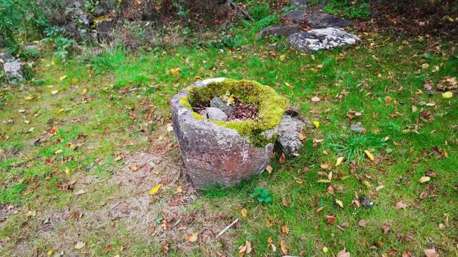 Ireland haunted places baptismal font in forgotten graveyard in the Kildare Countryside on Autumn memories of past times