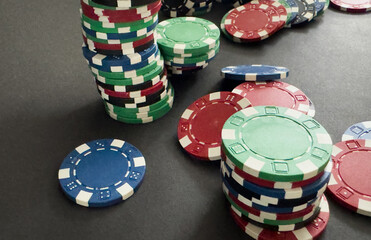 stack of chips play poker on background close up