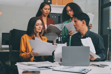 Stress, business people and employee frustrated with multitasking, pressure or overworked by team in chaos with paperwork. Anxiety, headache and worker overwhelmed by group and burnout in crisis