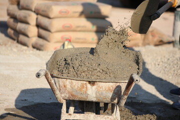 a worker preparing cement mortar