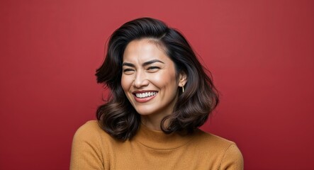 Fototapeta premium Young Latino woman with oval face and thick brown hair smirking dark red background