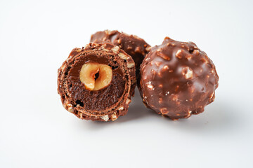 chocolate and hazelnut confectionery balls. chocolate sweet made. Chocolate candies in a gold wrapper