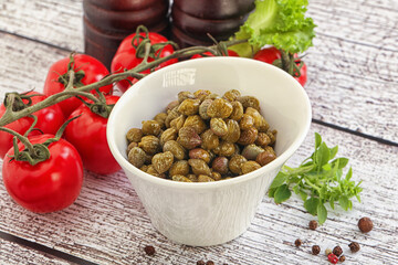 Marinated green capers in the bowl