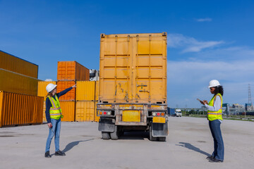 Female Workers Directing Cargo Truck at Container Yard: Logistics, Safety, and Transportation Coordination