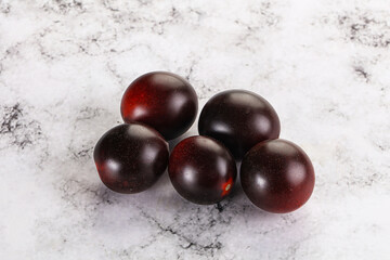 Raw ripe black kumato tomato