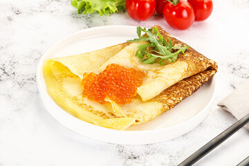 Russian pancake with red caviar