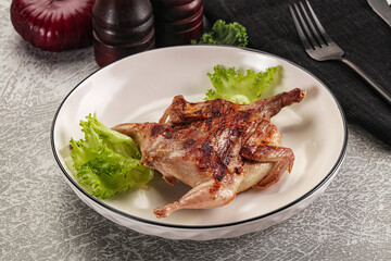 Grilled quail in the plate